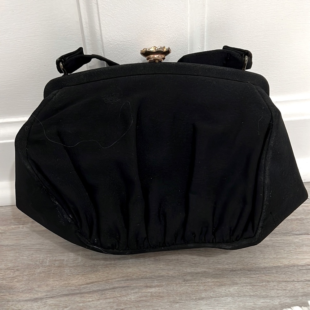 Vintage and rare black Garay evening bag with gold/crystal flower clasp